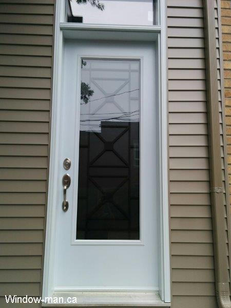Single steel insulated front door and transom. 92 inches 8 foot. Century contemporary wrought iron glass insert